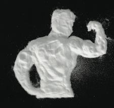 creatine supplement powder shaped like a bodybuilder